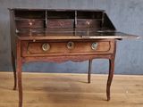 an old wooden desk with two drawers and a drawer on top of it