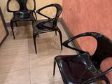 three chairs that are sitting in the corner of a room