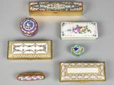 several different types of decorative boxes are arranged on a table