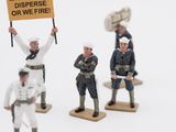 several figurines of men in uniforms holding up signs