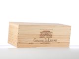 a wooden box with a bottle of wine inside of it