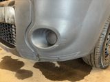 a dirty car that is sitting in the garage