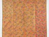un tissu orange et rose orné d'un motif floral