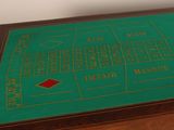 a close up of a table with a green cloth on it