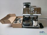 a coffee machine sitting in a box next to a box of coffee