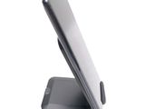 a cell phone that is sitting on top of a stand