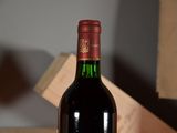 a bottle of wine that is sitting on a table