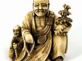 an image of a statue of a man with a dog and a cat
