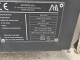 an image of a close up of a machine on a gravel surface