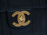 chanel logo on the back of a chanel bag