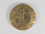 an image of a gold medal with a woman on it