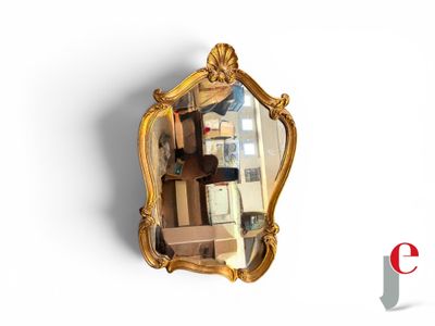 a mirror that is hanging on the wall in the room