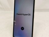 a close up of the back of a phone with the text xiaomi hyperos on it