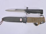 two knives that are laying next to each other on a table