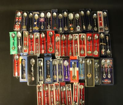 a lot of spoons and spoon spoons that are on display