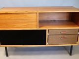 a close up of a wooden cabinet with two drawers and two drawers