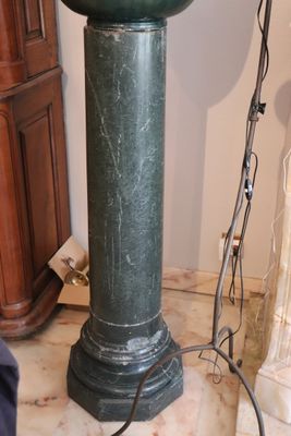 an image of a green pedestal sink in a bathroom