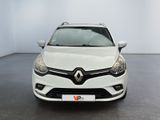 the front view of a white car in a white room