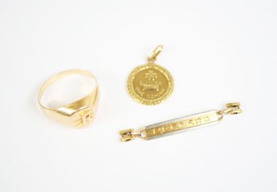 a gold ring, a gold bar, and a gold coin