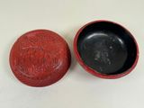 an image of a red box with a lid on a white surface