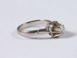 an image of a diamond ring on a white surface