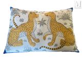 a close up of a pillow with two cheetah on it