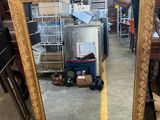 a large mirror that is sitting on the floor