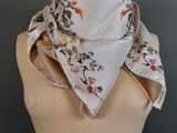a close up of a mannequin torso with a scarf on it
