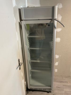an image of a refrigerator that is in a room