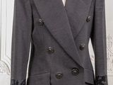 an image of a woman ' s coat on a mannequin dummy