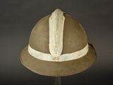 a helmet that is on a stand on a table