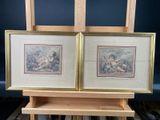 two framed pictures of a couple of people on a wooden easel