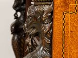 a wooden table with a lion head on top of it
