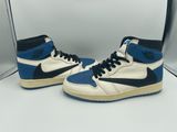 a pair of blue and white sneakers on a white surface