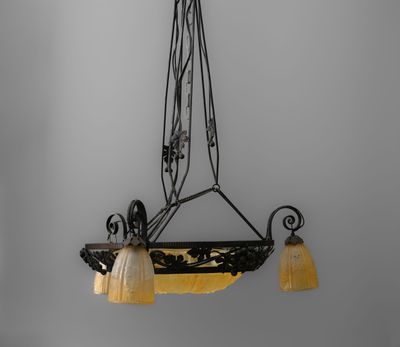 a black and white photo of a chandelier hanging from the ceiling