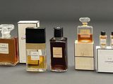 several different types of perfume bottles lined up in a row