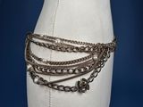an image of a mannequin with chains and pearls on it