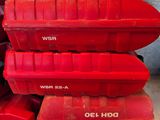a stack of red boxes sitting on top of a counter