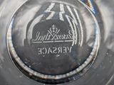 a close up of a glass with a logo on it