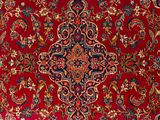 a close up of a red carpet with a floral design on it