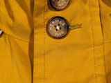 a close up of a buttoned jacket on a mannequin mannequin mannequin mannequin mannequin mannequin manne