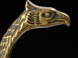 an image of a close up of a metal object with a bird ' s head
