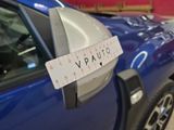 a close up of a car with a measuring tape on the side of it