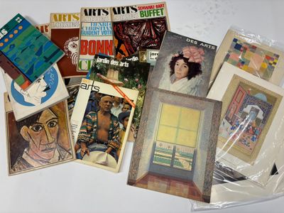 a lot of books on the table with pictures on them