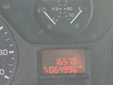 a close up of a car dashboard with a clock on it