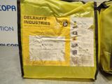 a yellow bag with a label on it sitting on a table