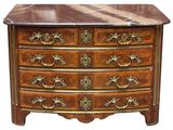 an antique chest of drawers with marble top and brass handles