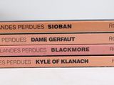 three books are stacked on top of each other on a table