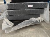 a stack of boxes sitting on top of a pile of plastic wrap