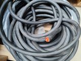 a large pile of hoses sitting on top of a cardboard box